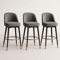Lot de 3 chaises de bar en velours gris avec pieds en bois noir et détails dorés